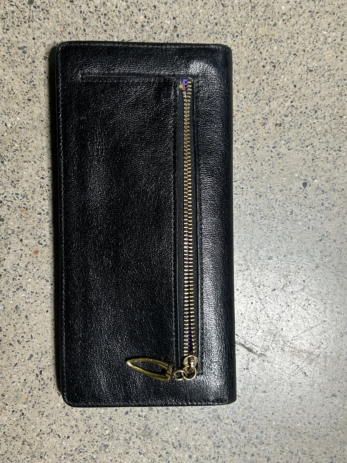 Black wallet with gold zipper