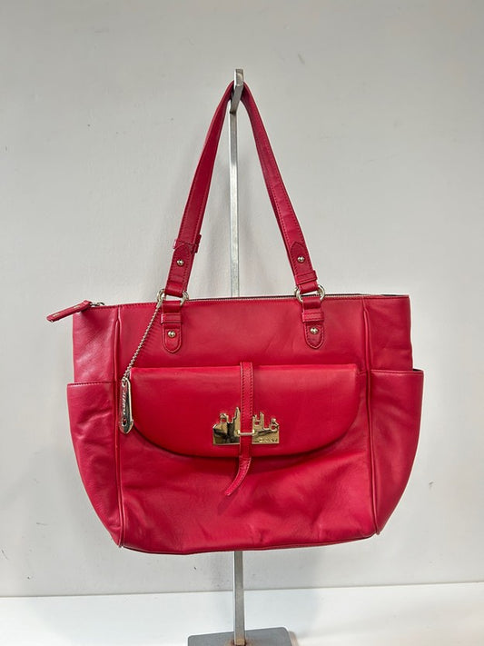 Red leather tote bag with gold tone metal hardware