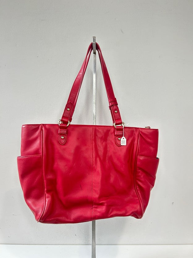 Red leather tote bag with gold tone metal hardware
