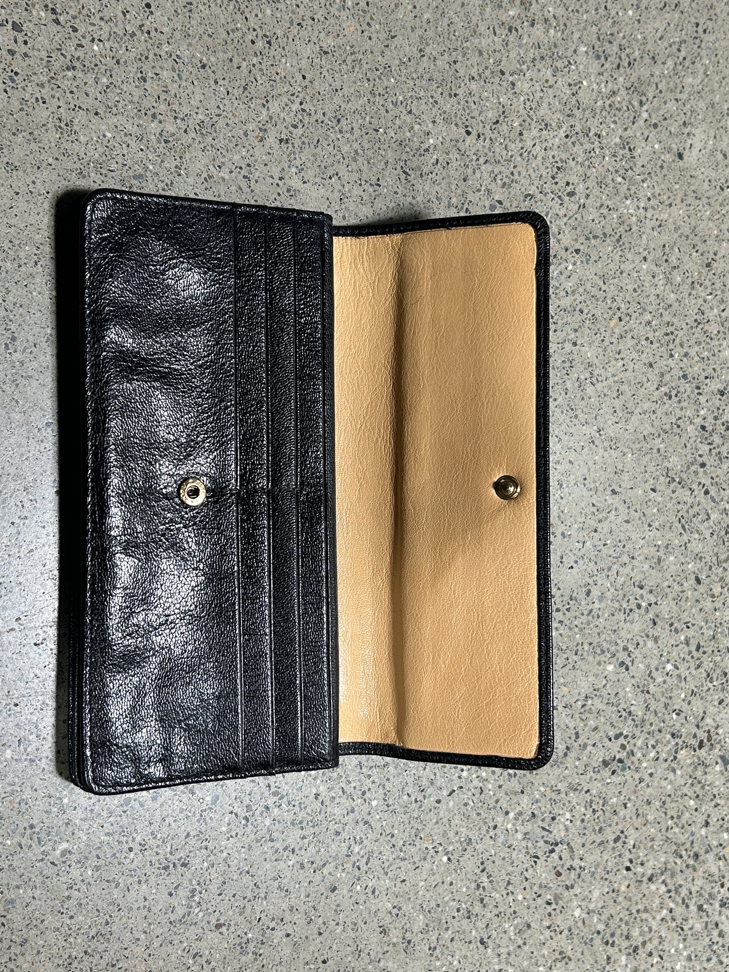 Black wallet with gold zipper