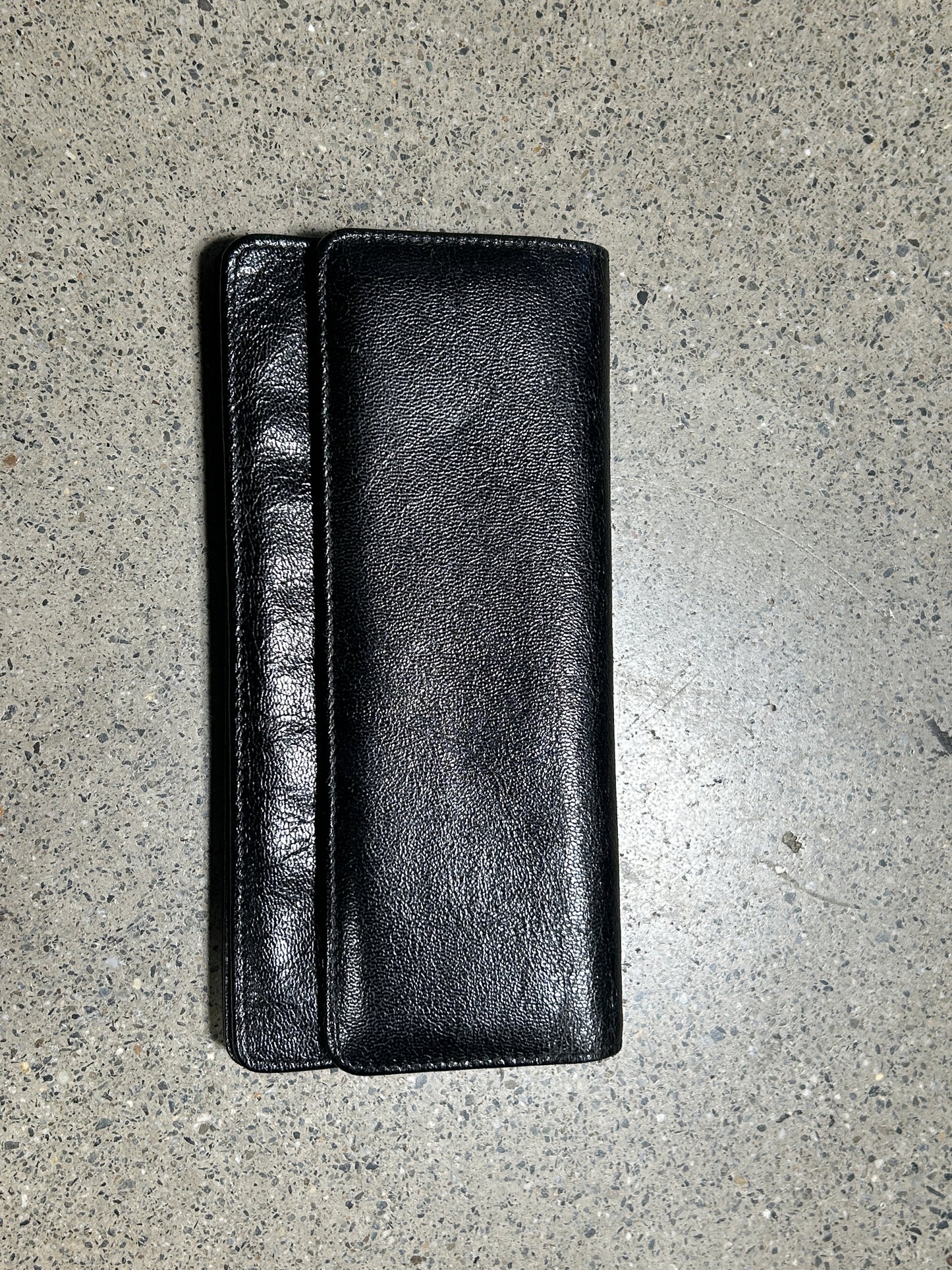 Black wallet with gold zipper