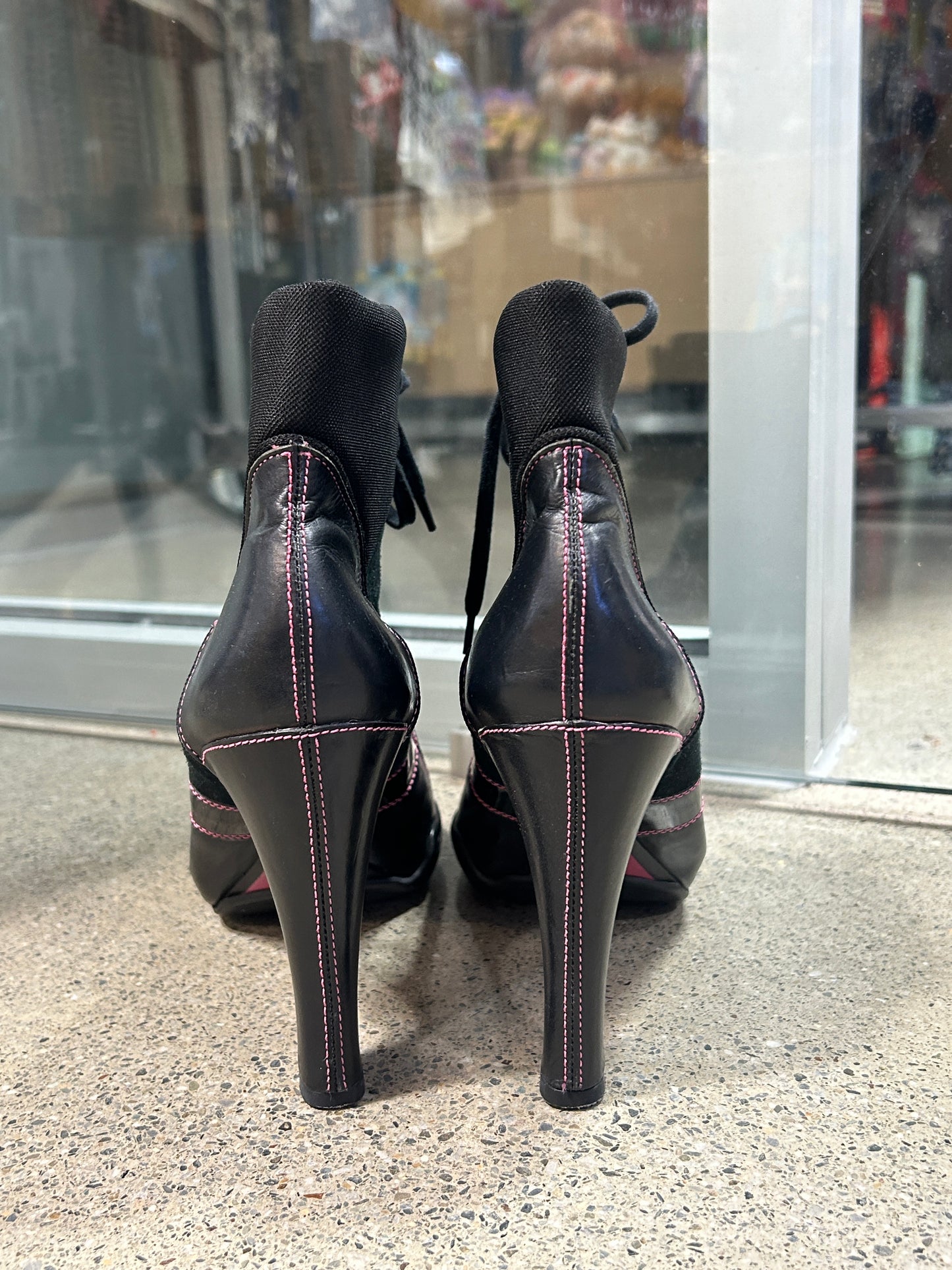 Black and pink lace-up heel boots